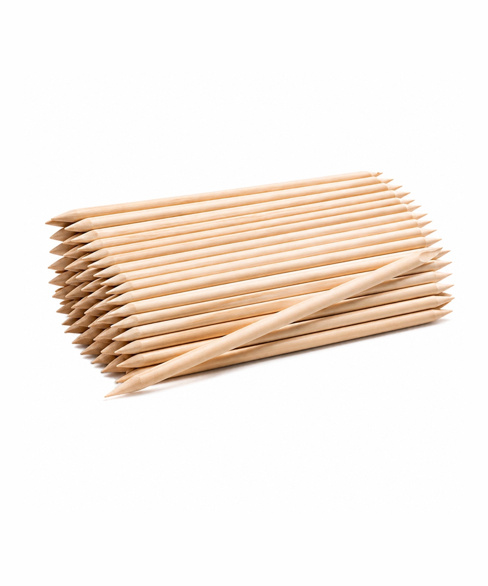 Pile of natural wood pencils stacked in parallel with sharpened tips on a white background
