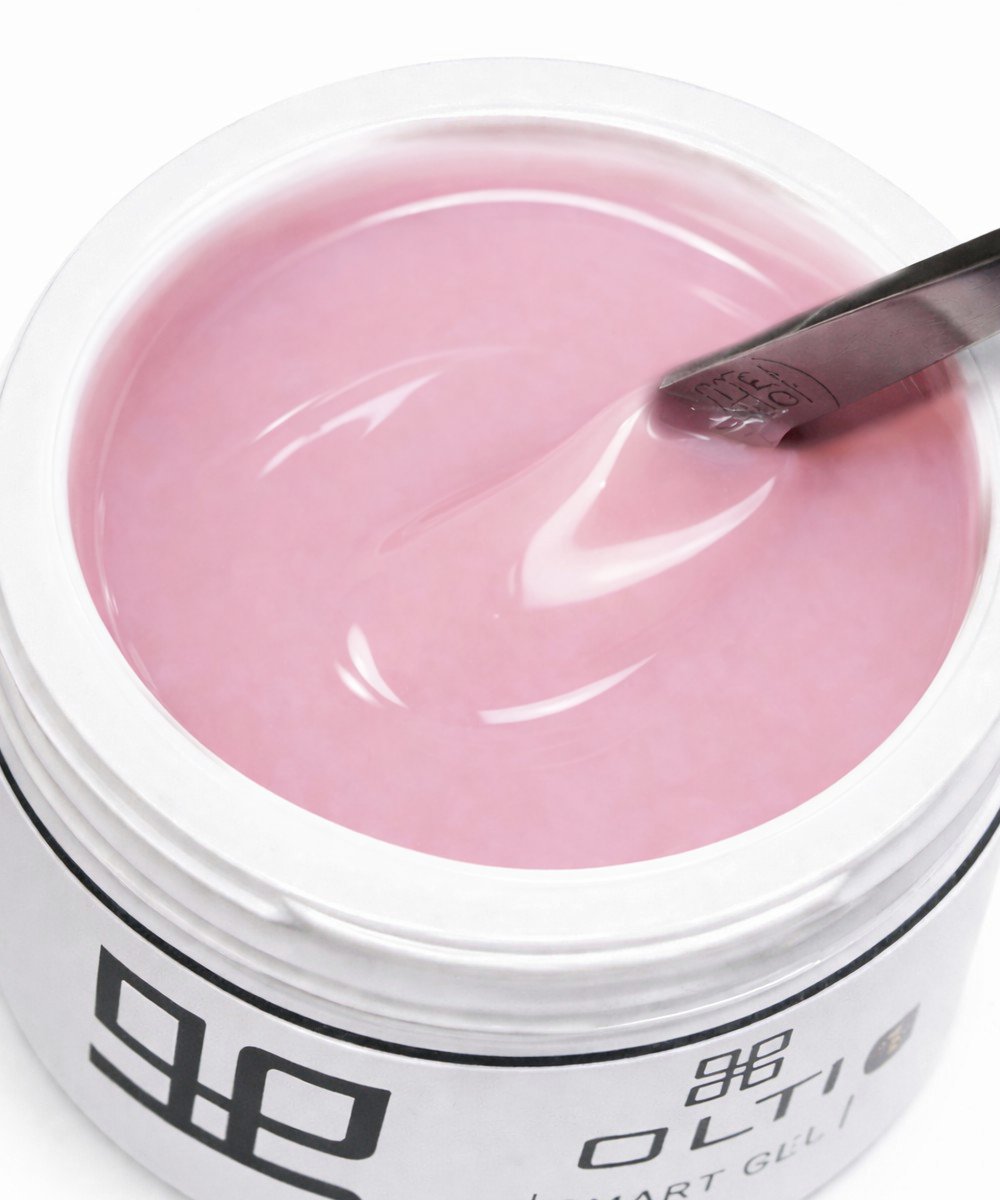 Pink gel nail polish in a white container